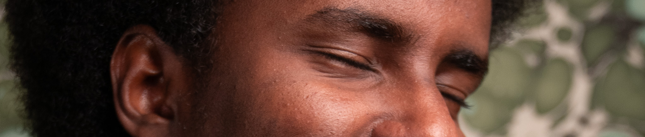 Wide cinematic crop of Anas at work